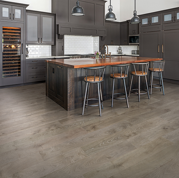 medium brown wood-look laminate flooring in a brown modern kitchen